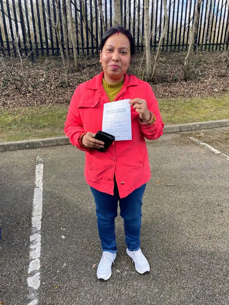 Learner celebrating after passing her driving test